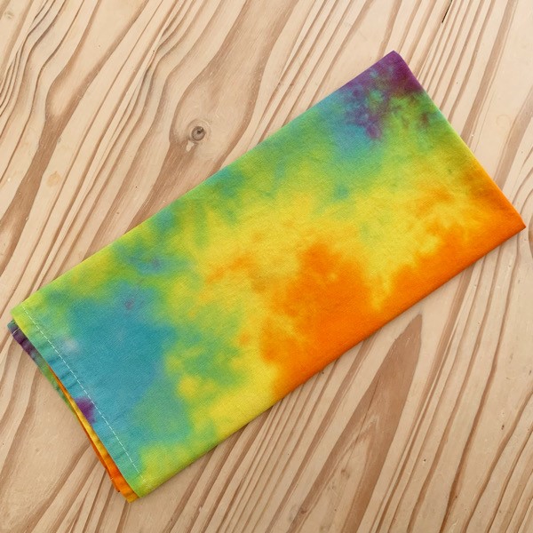 tea towel tie dyed in rainbow colours