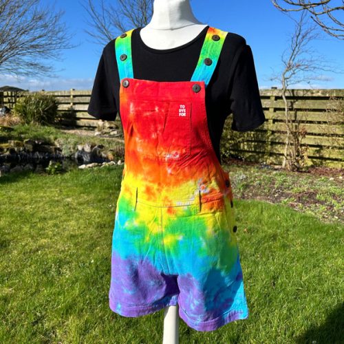 Short dungarees tie dyed in my rainbow colourway with red, orange, yellow, green, turquoise and purple.