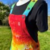 Short dungarees tie dyed in my rainbow colourway with red, orange, yellow, green, turquoise and purple.