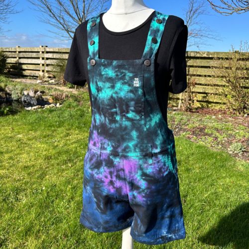 Short dungarees tie dyed in my black peacock colourway with teal, blue and purple slashed with black.