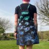 pinafore dress tie dyed in a black peacock colourway with teal, purple, blue and black