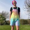 Short dungarees tie dyed in my pale rainbow colourway with pastel pink, orange, yellow, green, turquoise and purple.