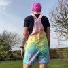 Short dungarees tie dyed in my pale rainbow colourway with pastel pink, orange, yellow, green, turquoise and purple.