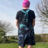 Short dungarees tie dyed in my black peacock colourway with teal, blue and purple slashed with black.