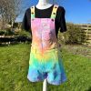 Short dungarees tie dyed in my pale rainbow colourway with pastel pink, orange, yellow, green, turquoise and purple.