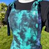 pinafore dress tie dyed in a black peacock colourway with teal, purple, blue and black