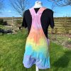 Short dungarees tie dyed in my pale rainbow colourway with pastel pink, orange, yellow, green, turquoise and purple.