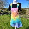 Short dungarees tie dyed in my pale rainbow colourway with pastel pink, orange, yellow, green, turquoise and purple.