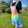 Short dungarees tie dyed in my pale rainbow colourway with pastel pink, orange, yellow, green, turquoise and purple.