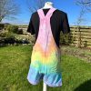 Short dungarees tie dyed in my pale rainbow colourway with pastel pink, orange, yellow, green, turquoise and purple.