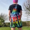 Short dungarees tie dyed in my black rainbow colourway with red, orange, yellow, green, turquoise and purple slashed with black.